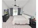 Bright main bedroom with carpeting, ceiling fan, and sliding glass doors to the pool at 7410 Locksley Ln, Lakeland, FL 33809