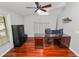 Office space featuring hardwood floors, ceiling fan, and large desk at 7410 Locksley Ln, Lakeland, FL 33809