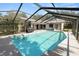 Aerial view of the screened-in pool, patio, porch swing, grill, and well-maintained landscaping at 7410 Locksley Ln, Lakeland, FL 33809