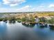 An aerial perspective reveals a lakeside property with a private dock and water views at 794 Lake Clark Ct, Lakeland, FL 33813