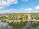 Aerial view featuring multiple homes with lakeside docks, showcasing the community's access to the water at 794 Lake Clark Ct, Lakeland, FL 33813