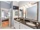 Bathroom featuring a double sink vanity with granite countertops at 794 Lake Clark Ct, Lakeland, FL 33813