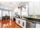 Modern kitchen with stainless steel appliances, pendant lights, and green subway tile backsplash at 794 Lake Clark Ct, Lakeland, FL 33813