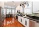 Modern kitchen with stainless steel appliances, pendant lights, and green subway tile backsplash at 794 Lake Clark Ct, Lakeland, FL 33813