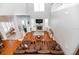 Lofted view of open-concept living room with fireplace and expansive windows at 794 Lake Clark Ct, Lakeland, FL 33813