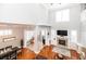 Lofted view of open-concept living room with fireplace and expansive windows at 794 Lake Clark Ct, Lakeland, FL 33813