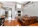 Open-concept living room featuring soaring ceilings, a stone fireplace, and hardwood floors at 794 Lake Clark Ct, Lakeland, FL 33813