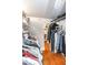 Walk-in closet with rods and shelves provides ample storage at 794 Lake Clark Ct, Lakeland, FL 33813