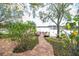 Picturesque waterfront view with private dock and lush landscaping at 794 Lake Clark Ct, Lakeland, FL 33813