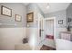 Well-lit bathroom with white subway tiles, a patterned rug, and a traditional-style bathtub at 815 Success Ave, Lakeland, FL 33801