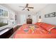 Large bedroom with wood floors, ceiling fan and an accent rug at 815 Success Ave, Lakeland, FL 33801