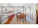 Cozy dining room featuring hardwood floors, lots of natural light, and a colorful area rug at 815 Success Ave, Lakeland, FL 33801