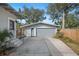 Spacious driveway leading to a detached garage, offering ample parking at 815 Success Ave, Lakeland, FL 33801