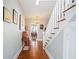 Hallway features hardwood floors, and a staircase leading to upper floors at 815 Success Ave, Lakeland, FL 33801