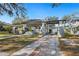 Beautiful craftsman style home with large porch and brick paved driveway leading to garage at 815 Success Ave, Lakeland, FL 33801