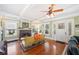 Inviting living room with hardwood floors, fireplace, coffered ceilings, and vintage furniture at 815 Success Ave, Lakeland, FL 33801