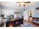 Cozy home office with a ceiling fan, hardwood floors, and a view into the living room at 815 Success Ave, Lakeland, FL 33801