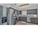 Well-lit kitchen with stainless steel appliances, wooden cabinets, and a decorative backsplash at 8185 Woodvine Cir, Lakeland, FL 33810