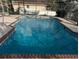 Large screened-in pool surrounded by brick trim at 838 Lakeshore Dr, Polk City, FL 33868