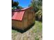 Backyard wooden shed for storing your gardening tools at 838 Lakeshore Dr, Polk City, FL 33868