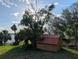 Backyard wooden shed for storing your gardening tools at 838 Lakeshore Dr, Polk City, FL 33868