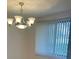 Dining area with chandelier and vertical blinds at 14 Buck Cir # 14, Haines City, FL 33844