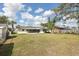 Spacious backyard with a screened-in porch, ideal for outdoor living at 144 Lowell Rd, Winter Haven, FL 33884