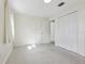 Neutral bedroom with closet, an entry door, and natural light, ready for personalization at 144 Lowell Rd, Winter Haven, FL 33884