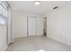 Bedroom featuring an entry doorway, bi-fold closet, and a sunny window at 144 Lowell Rd, Winter Haven, FL 33884