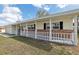 Well-maintained home with a covered porch and charming curb appeal at 144 Lowell Rd, Winter Haven, FL 33884