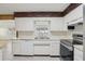 Well-lit kitchen with stainless steel appliances, white cabinetry, and a window over the sink offering a pleasant view at 144 Lowell Rd, Winter Haven, FL 33884