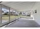 Covered porch offering a view of the fenced yard and a storage shed at 144 Lowell Rd, Winter Haven, FL 33884