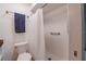 Clean bathroom featuring a white shower and neutral colored walls at 144 Mirror Nw Ln, Winter Haven, FL 33881