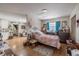 Bedroom with wood floors, blue curtains, and good natural light at 144 Mirror Nw Ln, Winter Haven, FL 33881