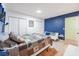 Bedroom with a cozy quilt and blue accent wall at 144 Mirror Nw Ln, Winter Haven, FL 33881