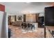 Open dining room area with tile flooring, a chandelier, and large windows at 144 Mirror Nw Ln, Winter Haven, FL 33881