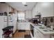 Bright kitchen with white cabinets, appliances, and a window at 144 Mirror Nw Ln, Winter Haven, FL 33881