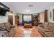 Comfortable living room with tiled floors, plush seating, and abundant natural light at 144 Mirror Nw Ln, Winter Haven, FL 33881