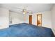 Bedroom featuring a window, carpet, view to ensuite bathroom and closet at 15 Tera Ln, Winter Haven, FL 33880