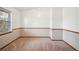 Neutral bedroom with chair rail and a large window offering plenty of light at 15 Tera Ln, Winter Haven, FL 33880