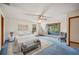 Staged bedroom featuring a sliding glass door to the patio, carpet, and a ceiling fan at 15 Tera Ln, Winter Haven, FL 33880