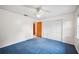 Bedroom featuring carpeted floor, a ceiling fan and a closet at 15 Tera Ln, Winter Haven, FL 33880