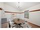 Dining room showcasing modern table and chairs, chandelier and natural light at 15 Tera Ln, Winter Haven, FL 33880