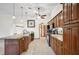 Modern kitchen featuring wooden cabinets, granite countertops, black appliances and tiled floor at 15 Tera Ln, Winter Haven, FL 33880