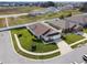 Aerial shot showcasing a home with solar panels and a manicured lawn at 1706 Tressel Ct, Winter Haven, FL 33881