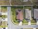 Overhead view of a residential property with solar panels, nestled in a suburban neighborhood at 1706 Tressel Ct, Winter Haven, FL 33881