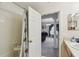 Bathroom featuring a shower/tub combination and a doorway to the living room at 1706 Tressel Ct, Winter Haven, FL 33881