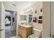 Bathroom showcasing a single sink vanity and tile flooring at 1706 Tressel Ct, Winter Haven, FL 33881