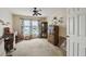 Bright bedroom featuring neutral walls, ceiling fan and lots of natural light at 1706 Tressel Ct, Winter Haven, FL 33881