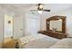 View of a bedroom with a dresser and an open doorway to another room at 1706 Tressel Ct, Winter Haven, FL 33881